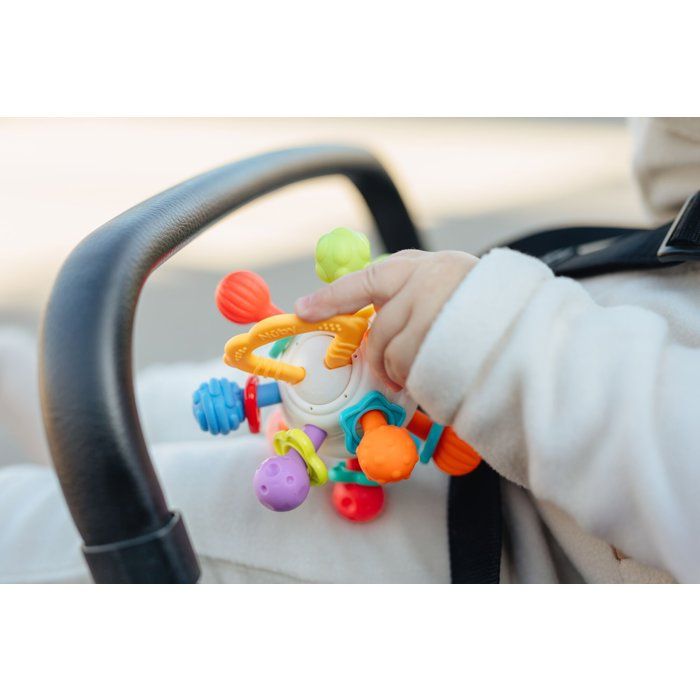 Anello da dentizione - NUBY - Palla girevole - Con sonaglio - Dai 3 mesi - Multicolore
